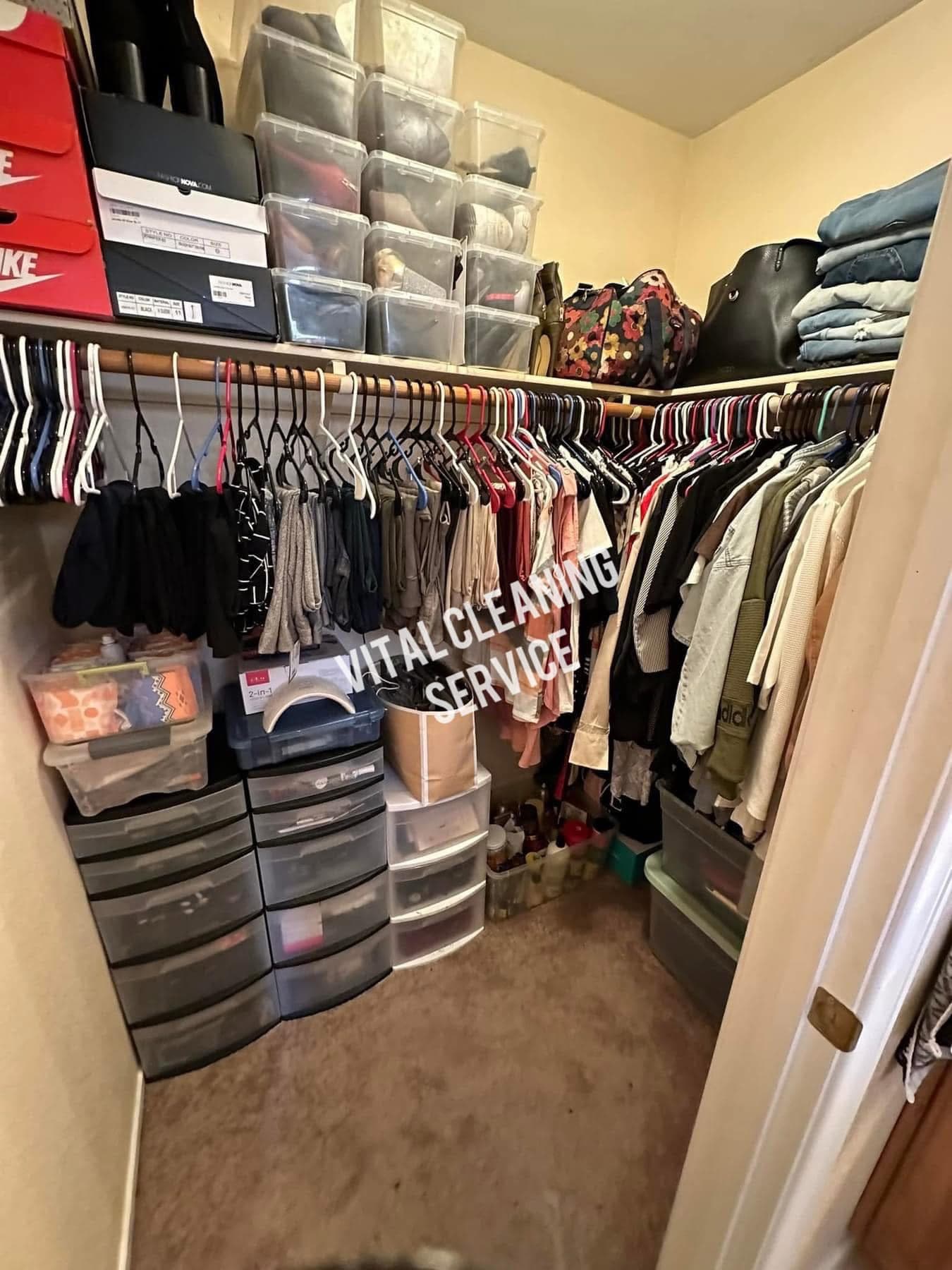 Neatly organized walk-in closet with sorted clothing and clear shoe storage by Vital Cleaning Service